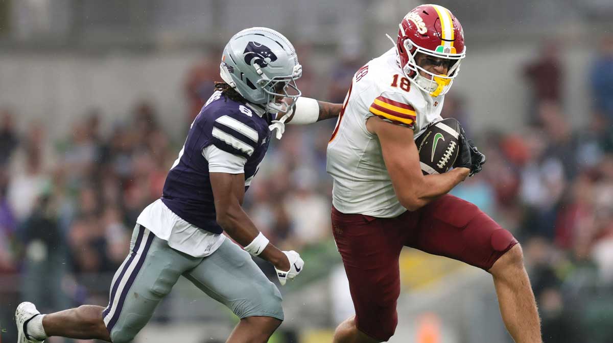 Iowa State player Benjamin Brahmer runs with the ball against Qua Moss of Kansas State during the Aer Lingus Classic between Iowa State and Kansas State at Aviva Stadium.