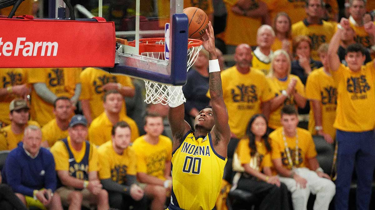 Indiana Pacers guard Bennedict Mathurin (00) reaches for the ball against the Oklahoma City Thunder during the second half of game six of the 2025 NBA Finals between the Oklahoma City Thunder and the Indiana Pacers at Gainbridge Fieldhouse.