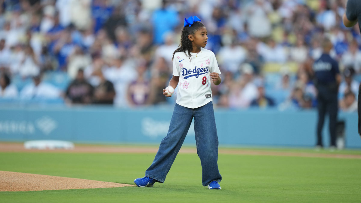 Aug 8, 2025; Los Angeles, California, USA; Bianka Bryant prepares to throw the first pitch before the game against Los Angeles Dodgers and Toronto Blue Jays at Dodger Stadium. Mandatory Credit: Kirby Lee-Imagn Images