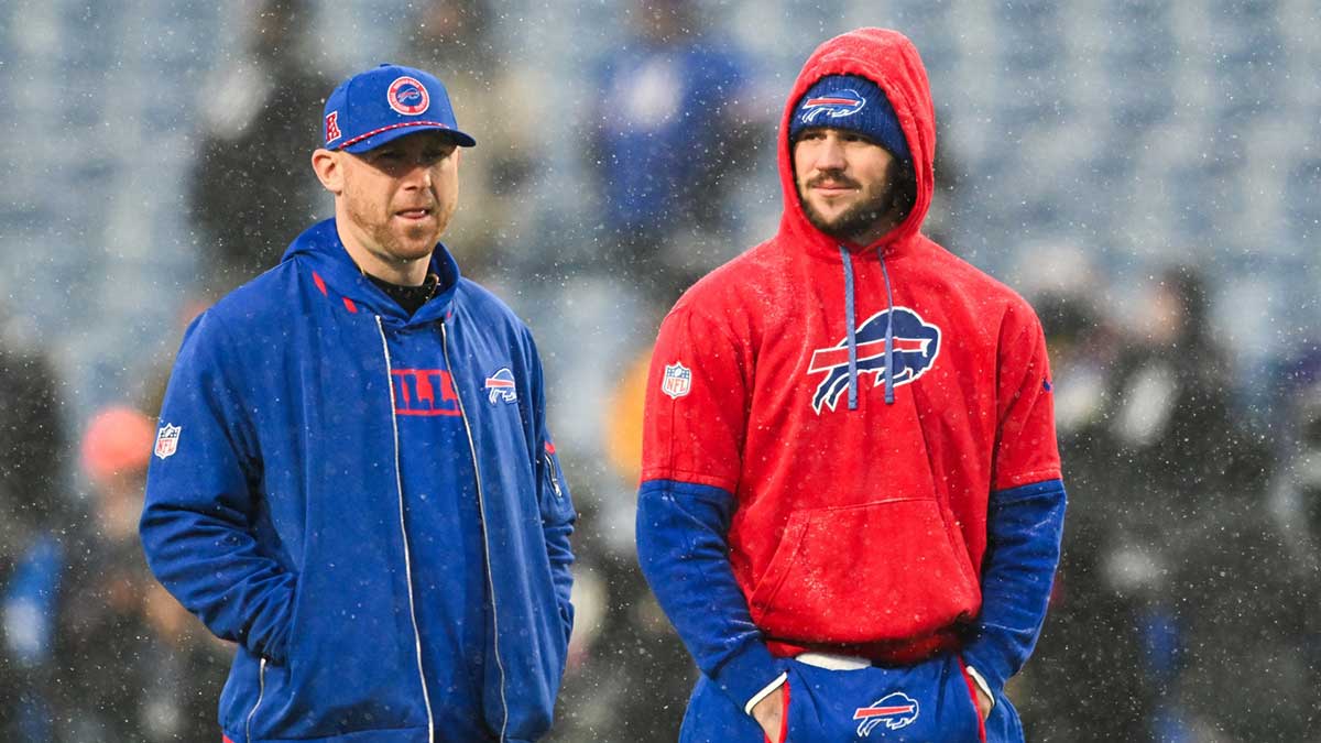 Buffalo Bills quarterback Josh Allen (17) speaks with Buffalo Bills Offensive Coordinator Joe Brady before the game against the Baltimore Ravens in a 2025 AFC divisional round game at Highmark Stadium. 