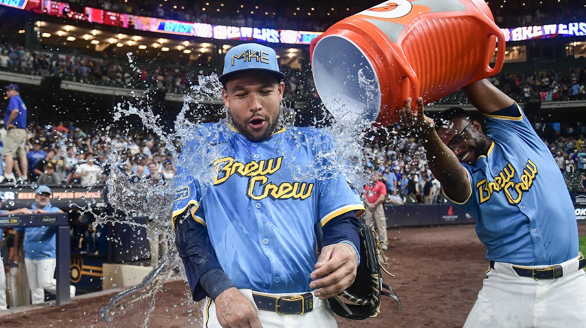 Aug 8, 2025; Milwaukee, Wisconsin, USA; Milwaukee Brewers center fielder Blake Perkins (16) is dunked by shortstop Andruw Monasterio (14) after the Brewers beat the New York Mets at American Family Field.