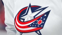 View of a Columbus Blue Jackets logo on a jersey worn by a member of the team during warm-up before the game against the Montreal Canadiens at Bell Centre.