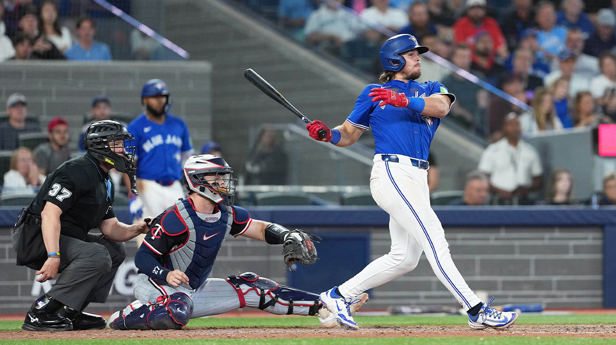 Aug 27, 2025; Toronto, Ontario, CAN; Toronto Blue Jays third baseman Addison Barger (47) hits a two run double against the Minnesota Twins during the eighth inning at Rogers Centre.