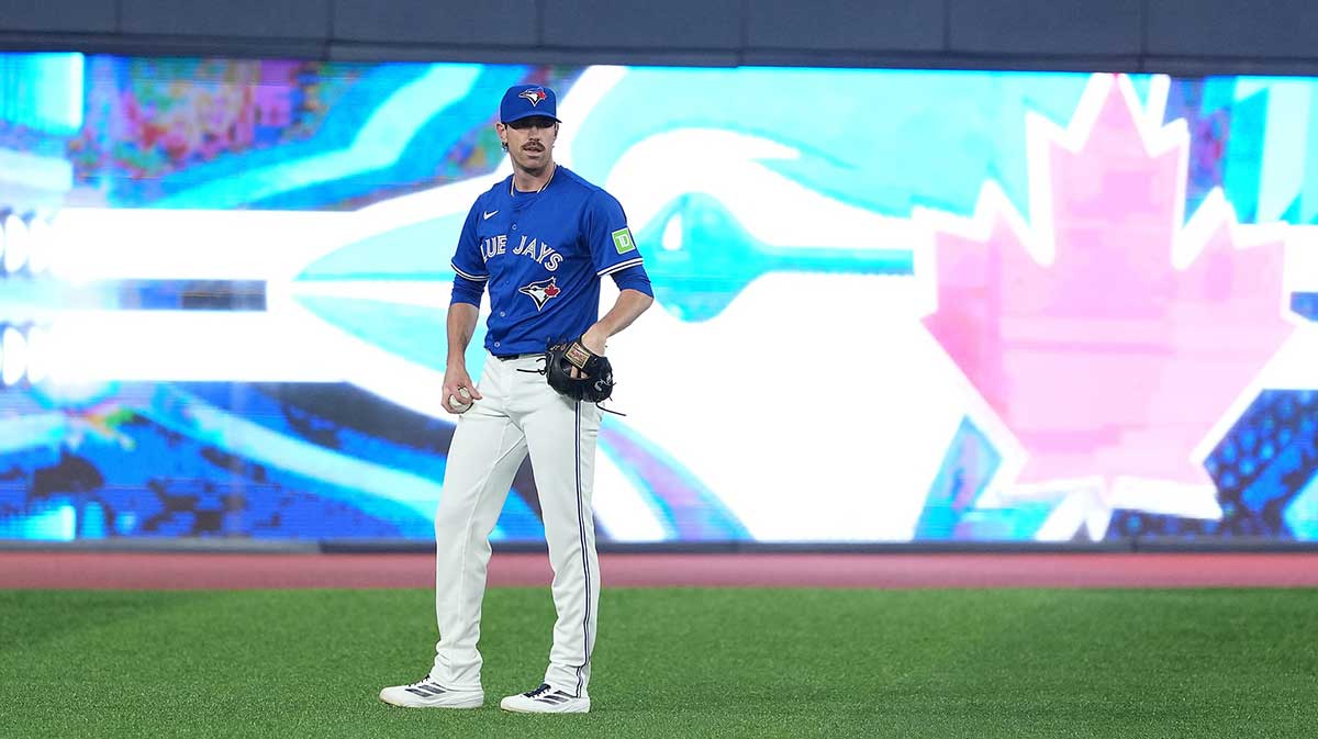 Toronto Blue Jays pitcher Shane Bieber (57) takes a break during batting practice before a game against the Chicago Cubs at Rogers Centre.