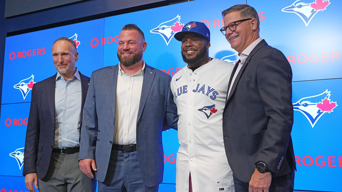 From left to right Toronto Blue Jays President and CEO Mark Shapiro and manager John Schneider and Vladimir Guerrero Jr. and general manager Ross Atkins pose for a photo during the press conference at Rogers Centre.