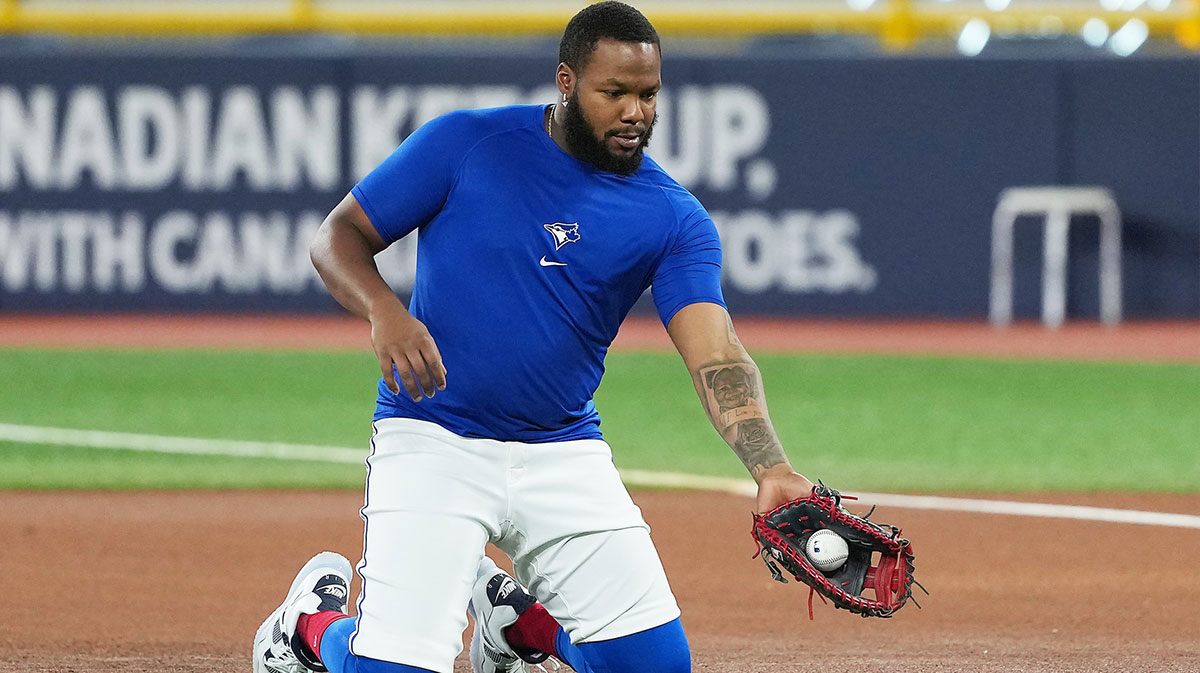 Toronto Blue Jays first baseman Vladimir Guerrero Jr. (27) fields balls during batting practice before a game against the Texas Rangers at Rogers Centre.