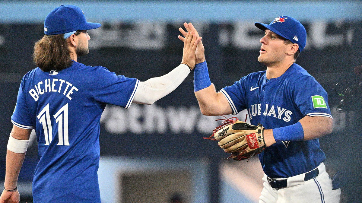 Toronto Blue Jays left fielder Daulton Varsho (25) celebrates with shortstop Bo Bichette (11) after a win over the Colorado Rockies at Rogers Centre.
