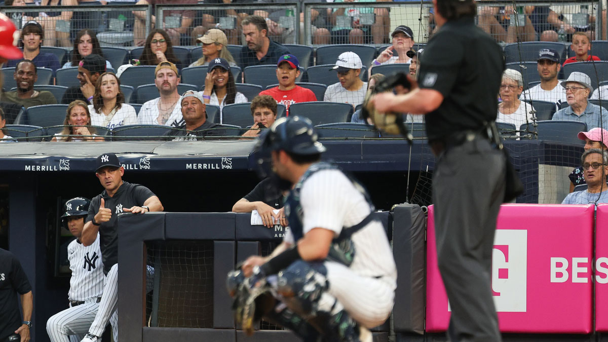 New York Yankees manager Aaron Boone (17) talks with umpire DJ Reyburn (17) during the second inning against the Philadelphia Phillies at Yankee Stadium.