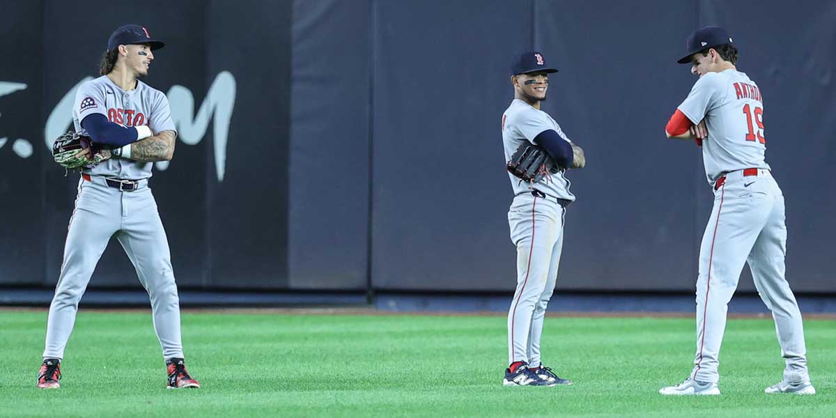 Boston Red Sox left fielder Jarren Duran (16), center fielder Ceddanne Rafaela (3) and right fielder Roman Anthony (19) pose after defeating the New York Yankees 6-3 at Yankee Stadium.
