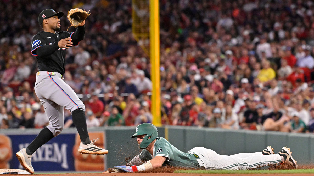 Boston Red Sox shortstop Trevor Story (10) steals second base against Miami Marlins second baseman Xavier Edwards (9) during the fifth inning at Fenway Park.