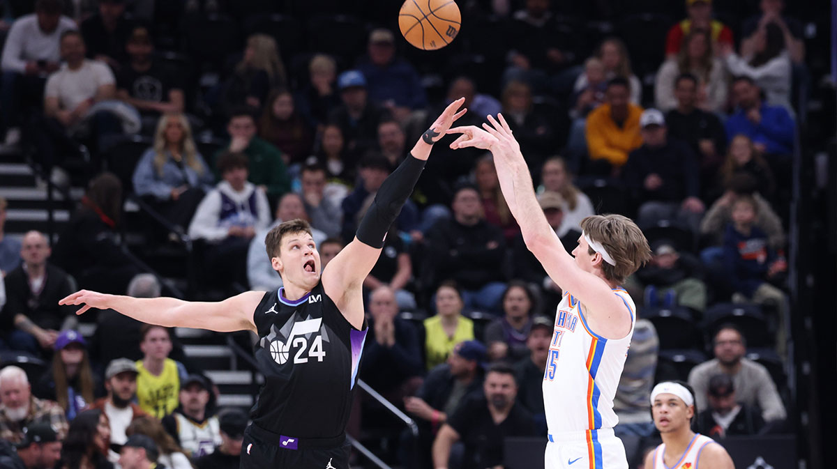 Oklahoma City Thunder center Brandon Carlson (15) makes a 3-point shot over Utah Jazz center Walker Kessler (24) during the fourth quarter at Delta Center.