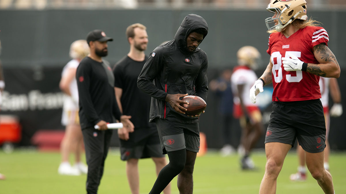 Still recovering from knee surgery, San Francisco 49ers wide receiver Brandon Aiyuk (left) hangs out with teammate George Kittle (85) during the second day of training camp.