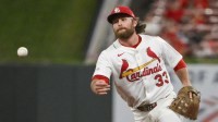 St. Louis Cardinals second baseman Brendan Donovan (33) flips the ball to first base during the ninth inning against the Colorado Rockies at Busch Stadium.