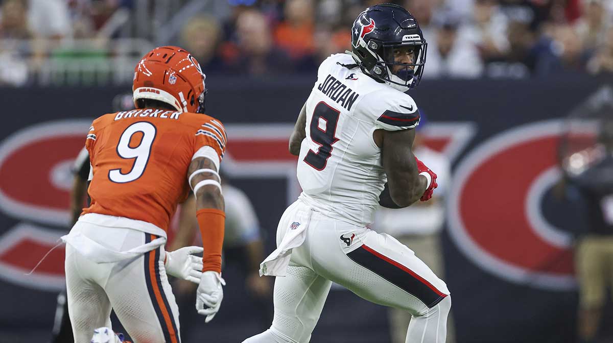Houston Texans tight end Brevin Jordan (9) makes a reception as Chicago Bears safety Jaquan Brisker (9) defends during the first quarter at NRG Stadium.