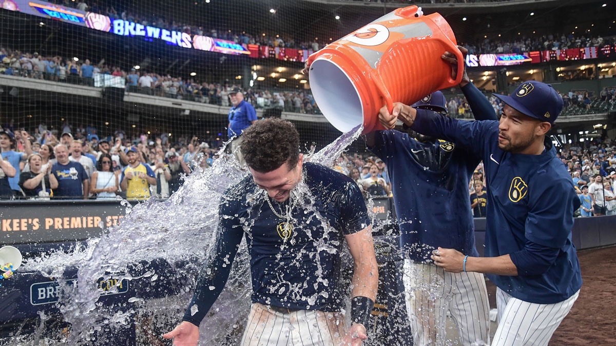 Milwaukee Brewers left fielder Isaac Collins (6) gets a postgame dunk after hitting a walkoff home run against the New York Mets at American Family Field.