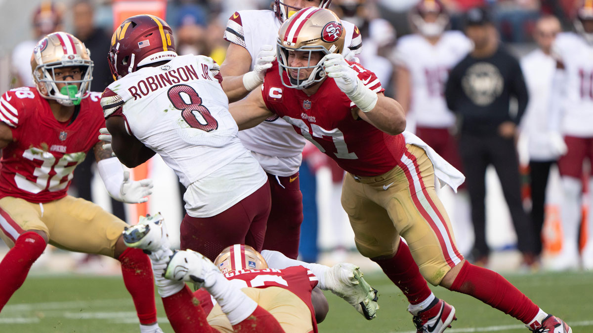 San Francisco 49ers defensive end Nick Bosa (97) attempts to tackle Washington Commanders running back Brian Robinson Jr. (8) during the third quarter at Levi's Stadium