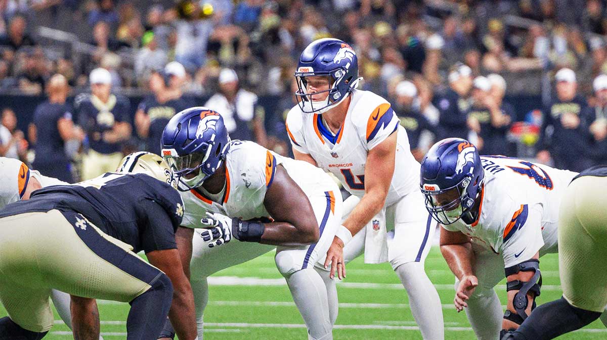 Denver Broncos quarterback Sam Ehlinger (4) calls for he ball against the New Orleans Saints during the second half at Caesars Superdome.