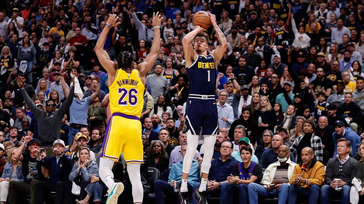 Denver Nuggets forward Michael Porter Jr. (1) attempts a shot as Los Angeles Lakers guard Spencer Dinwiddie (26) defends in the third quarter during game five of the first round for the 2024 NBA playoffs at Ball Arena.