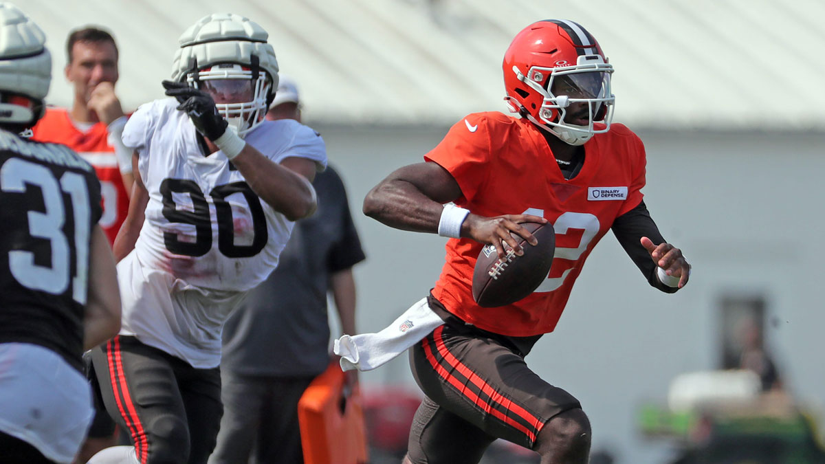 Cleveland Browns quarterback Shedeur Sanders (12) runs for a short gain during NFL training camp at CrossCountry Mortgage Campus.