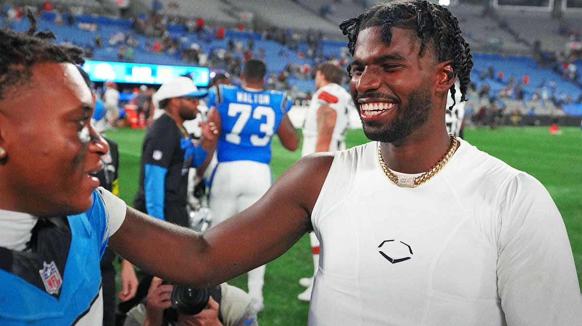 Browns quarterback Shedeur Sanders (12) with Carolina Panthers wide receiver Jimmy Horn Jr. (15) after the game at Bank of America Stadium