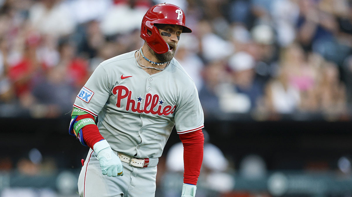 Philadelphia Phillies first baseman Bryce Harper (3) runs after hitting a two-run double against the Chicago White Sox during the third inning at Rate Field.