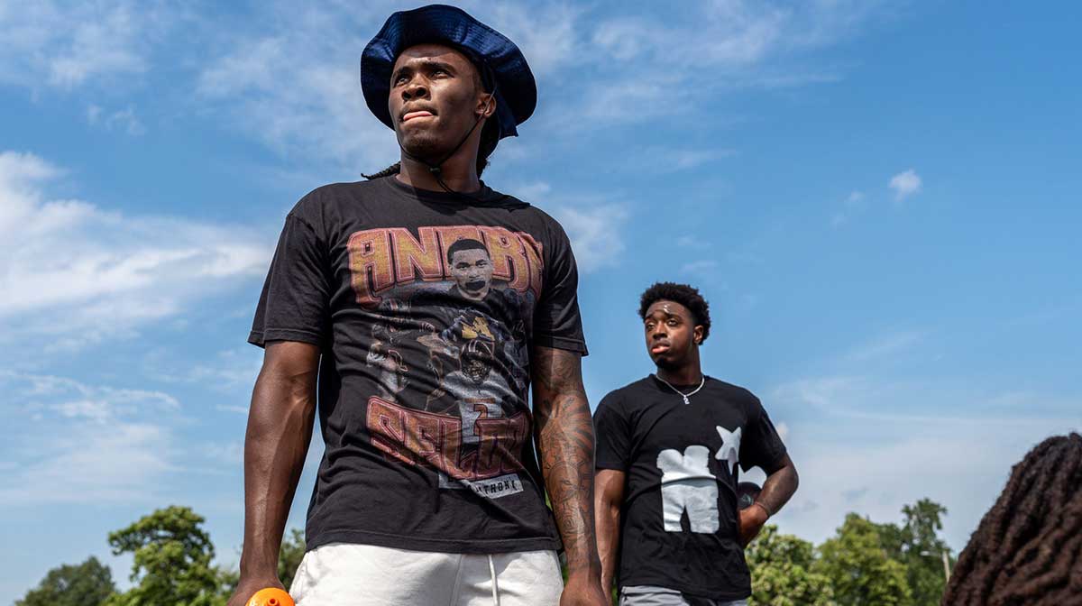 Bryce Underwood, 17, a freshman quarterback at Michigan and the nation’s No. 1 recruit in the 2025 class, left, stands next to Michigan State junior quarterback Aidan Chiles, 19, during a private workout