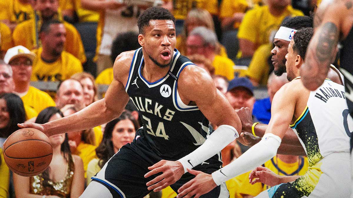 Bucks forward Giannis Antetokounmpo (34) dribbles the ball while Indiana Pacers forward Jarace Walker (5) defends during game five of the first round for the 2024 NBA Playoffs at Gainbridge Fieldhouse