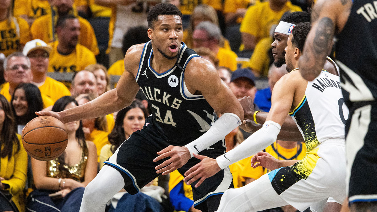 Bucks forward Giannis Antetokounmpo (34) dribbles the ball while Indiana Pacers forward Jarace Walker (5) defends during game five of the first round for the 2024 NBA Playoffs at Gainbridge Fieldhouse