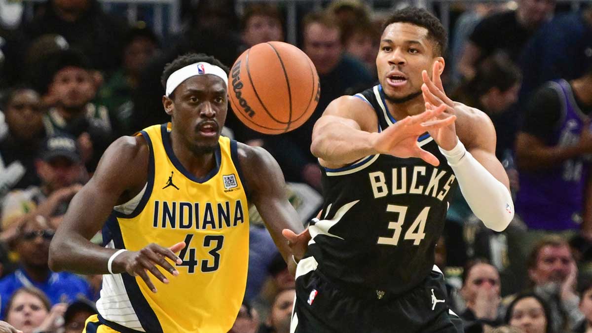 Bucks forward Giannis Antetokounmpo (34) passes the ball away from Indiana Pacers forward Pascal Siakam (43) in the first quarter during game four of first round for the 2024 NBA Playoffs at Fiserv Forum