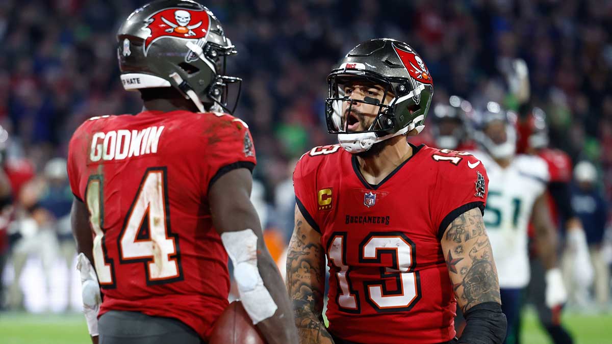 Tampa Bay Buccaneers wide receiver Chris Godwin (14) celebrates his touchdown with teammate wide receiver Mike Evans (13) against the Seattle Seahawks during the fourth quarter of an International Series game at Allianz Arena.