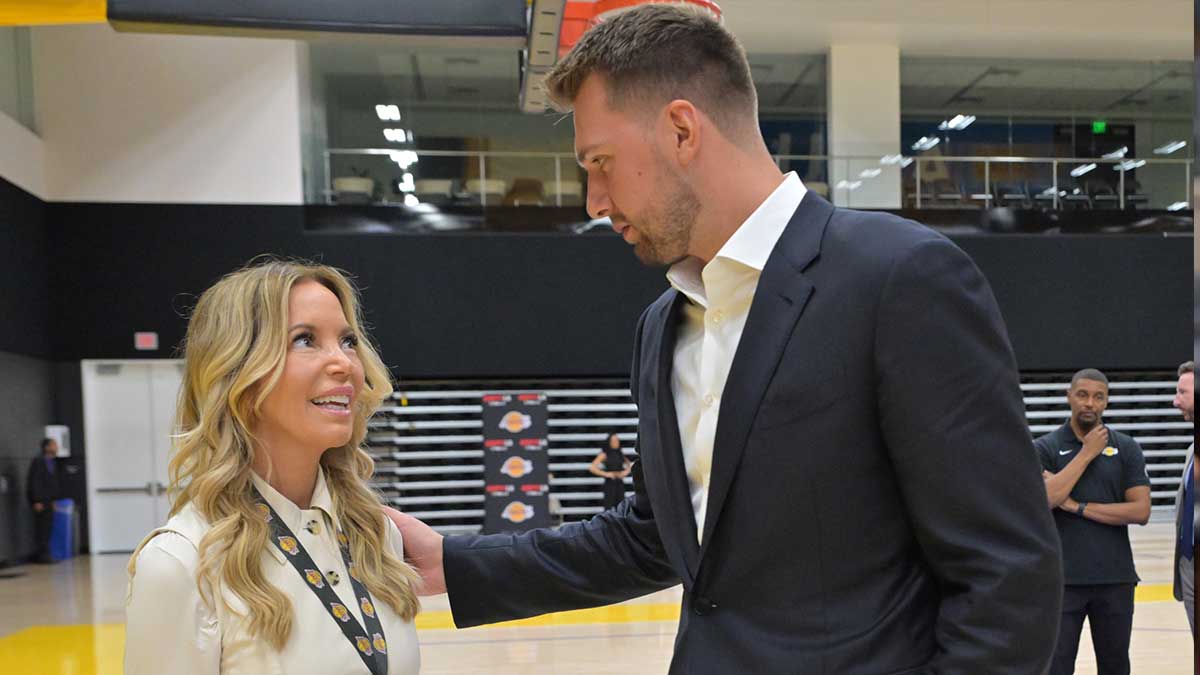 Los Angeles Lakers Luka Doncic (77) talks with team co-owner Jeanie Buss following a press conference announcing the signing of a 3-year, $165 million contract extension at UCLA Health Training Center.