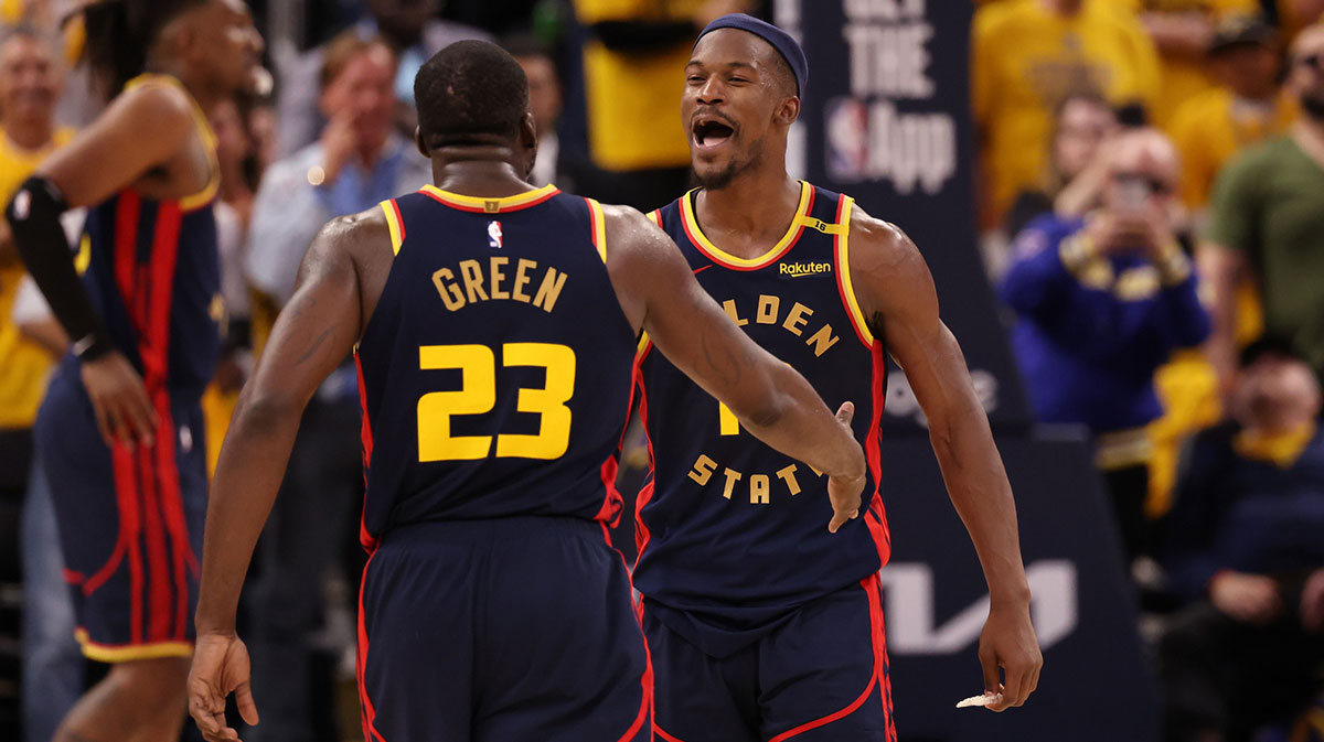 Golden State Warriors forward Draymond Green (23) celebrates with forward Jimmy Butler III (10) after a play against the Houston Rockets during the fourth quarter of game four of the 2025 NBA Playoffs first round at Chase Center.