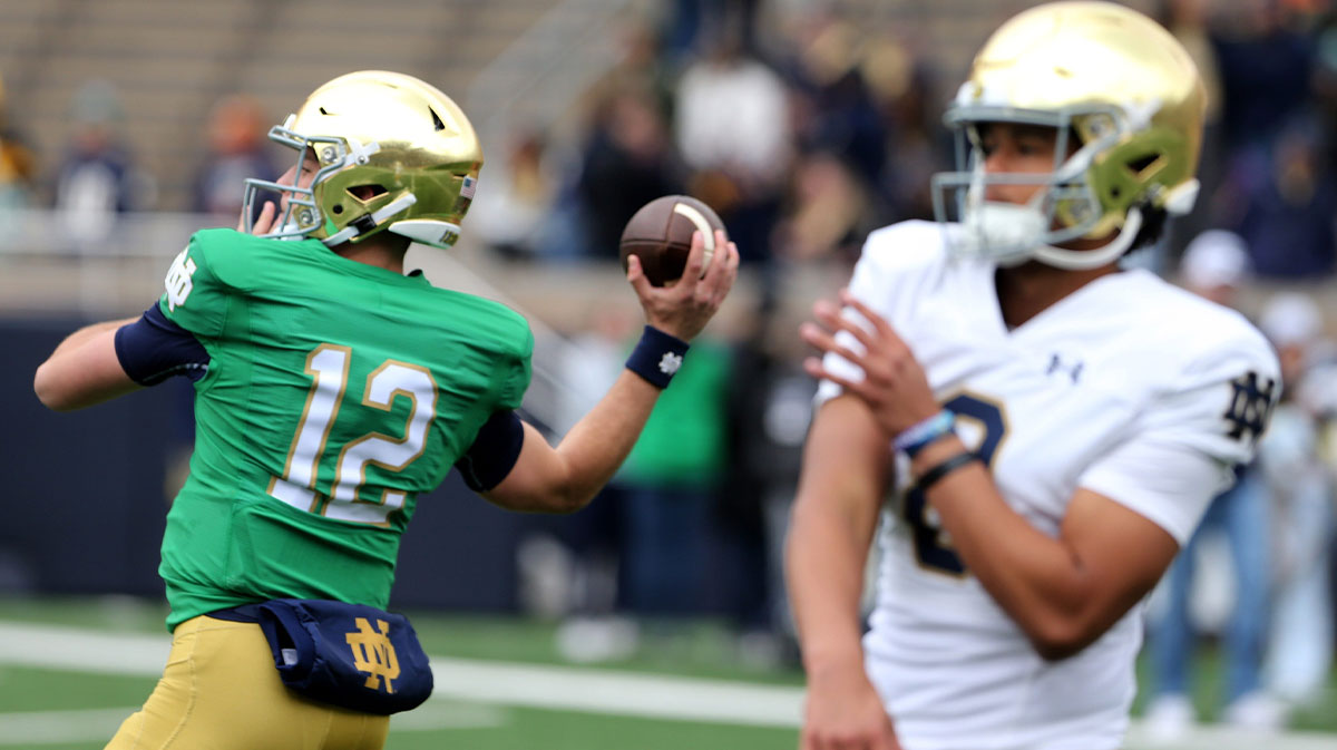 Notre Dame quarterbacks CJ Carr (12) and Kenny Minchey (8) warm up Saturday, April 20, 2024, at the annual Notre Dame Blue-Gold spring football game at Notre Dame Stadium in South Bend.