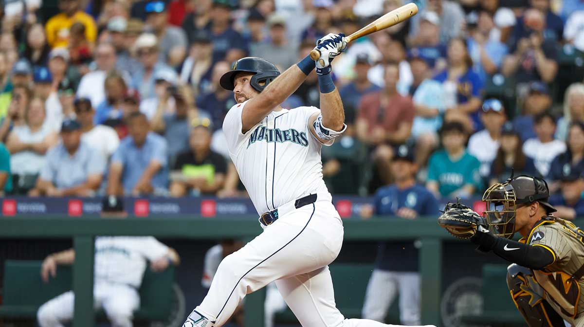 Seattle Mariners catcher Cal Raleigh (29) hits a solo-home run against the San Diego Padres during the first inning at T-Mobile Park. The home run is the 50th of the season for Raleigh.