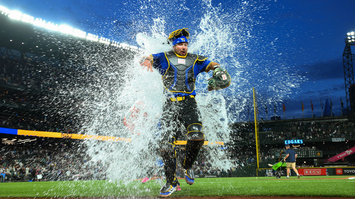 Seattle Mariners catcher Cal Raleigh (29) is dunked with the cooler after the game against the Tampa Bay Rays at T-Mobile Park.