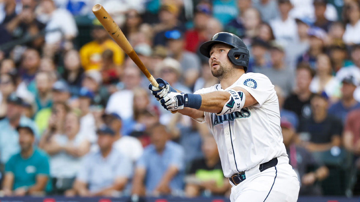 Seattle Mariners catcher Cal Raleigh (29) hits a solo-home run against the San Diego Padres during the first inning at T-Mobile Park. The home run is the 50th of the season for Raleigh.