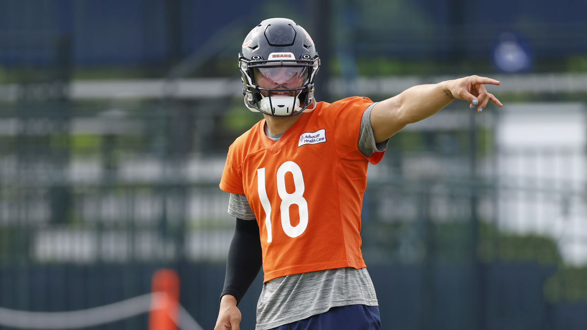 Chicago Bears quarterback Caleb Williams (18) signals during training camp at Halas Hall.