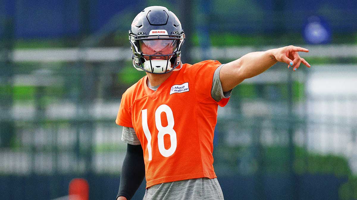 Chicago Bears quarterback Caleb Williams (18) signals during training camp at Halas Hall.