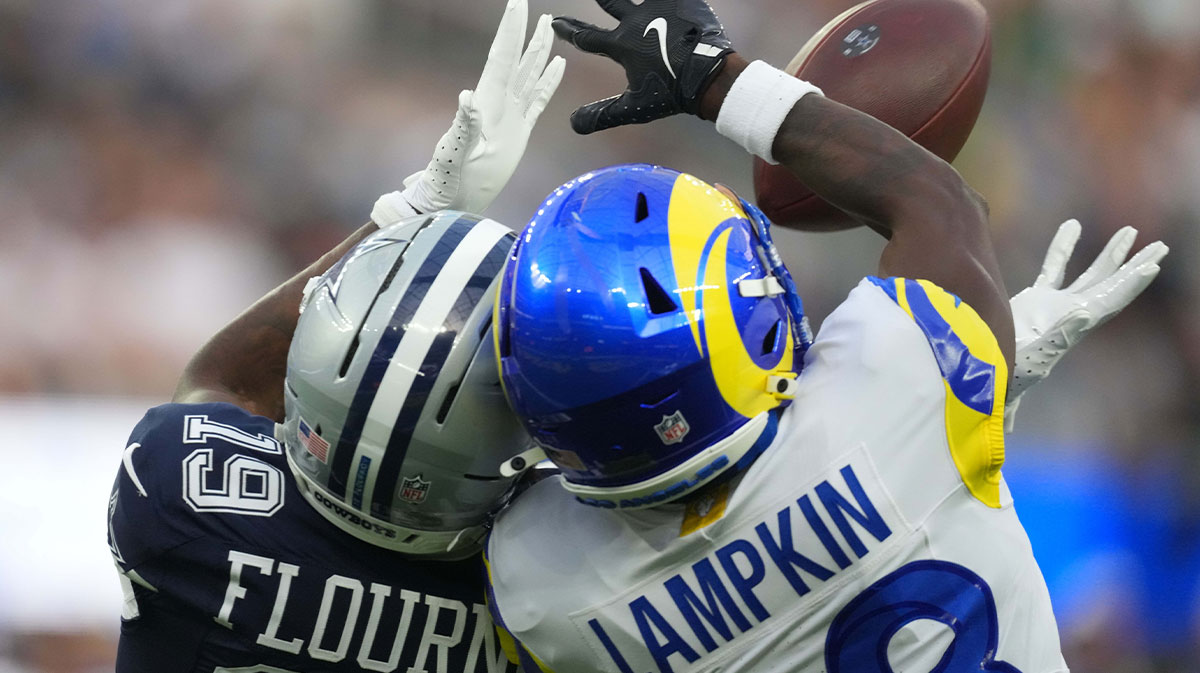 Los Angeles Rams cornerback Cam Lampkin (33) intercepts a pass intended for Dallas Cowboys wide receiver Ryan Flournoy (19) in the second half at SoFi Stadium.