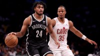 Brooklyn Nets guard Cam Thomas (24) controls the ball against Cleveland Cavaliers forward Isaac Okoro (35) during the third quarter at Barclays Center.