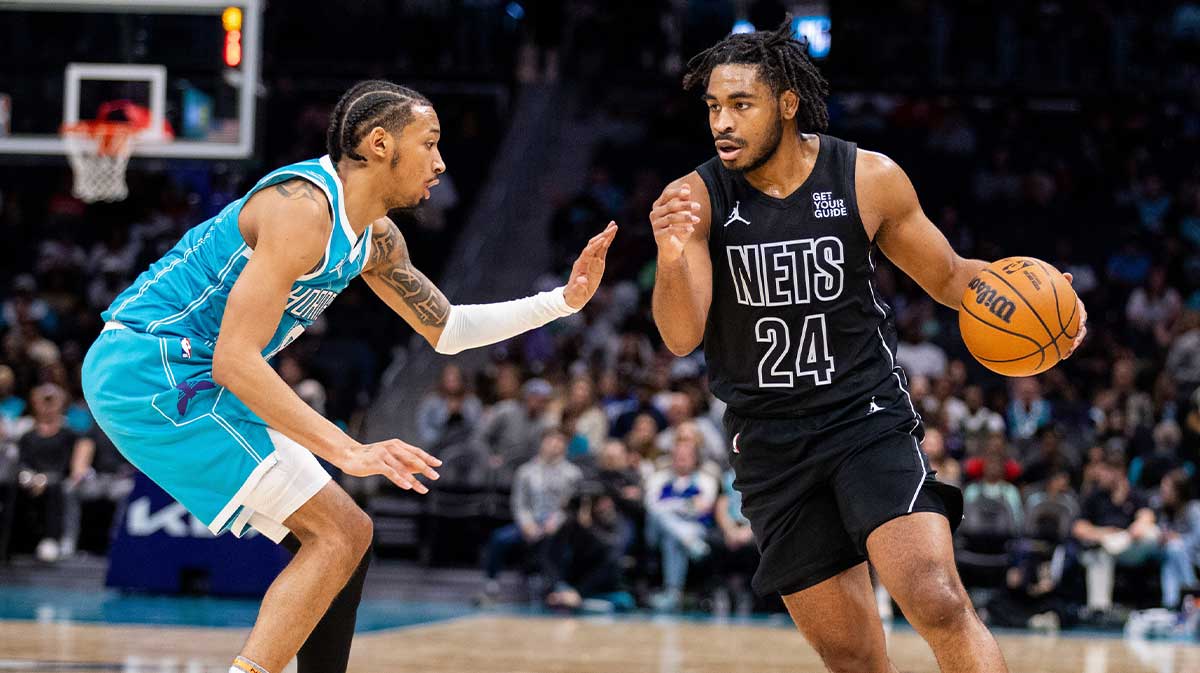 Brooklyn Nets guard Cam Thomas (24) drives on Charlotte Hornets guard Nick Smith Jr. (8) during the second quarter at Spectrum Center.