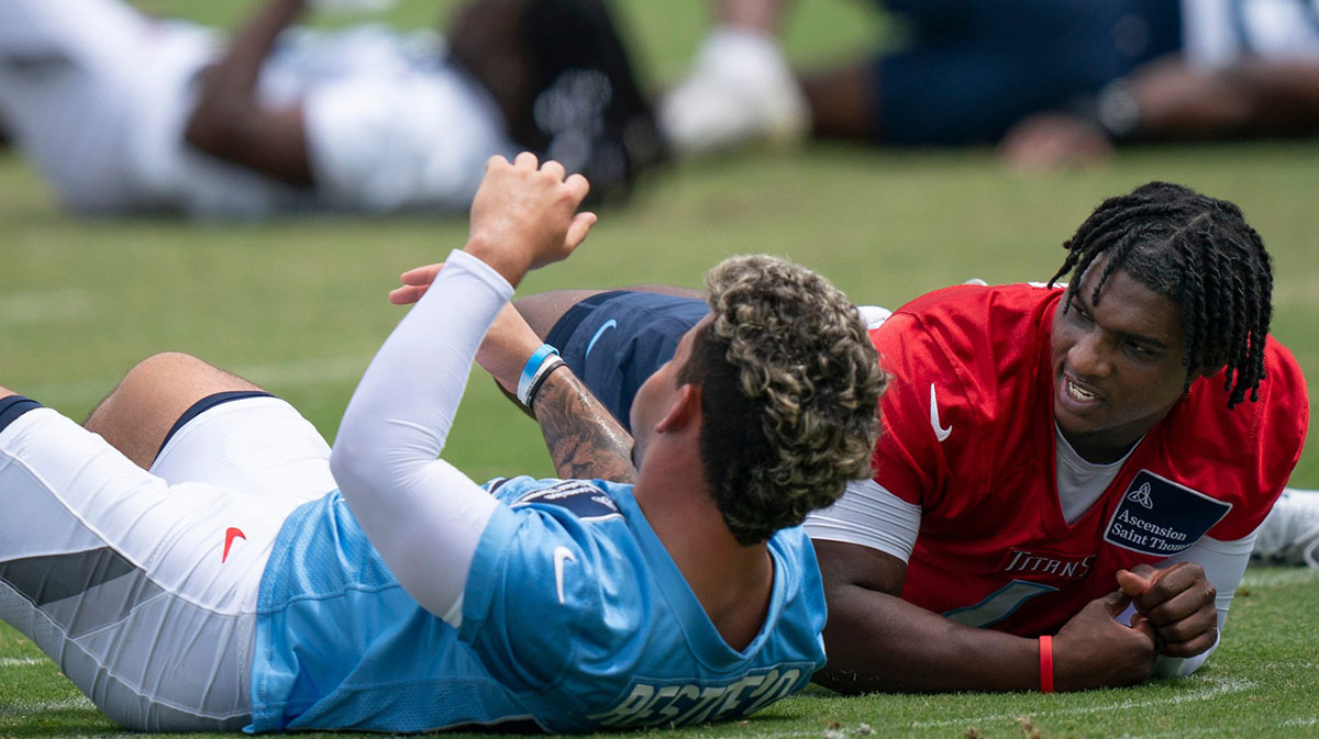 Tennessee Titans Xavier Restrepo, left, and Cam Ward stretch during OTAs at Ascension Saint Thomas Sports Park in Nashville, Tenn., Wednesday, May 28, 2025. The two were former teammates at the University of Miami.