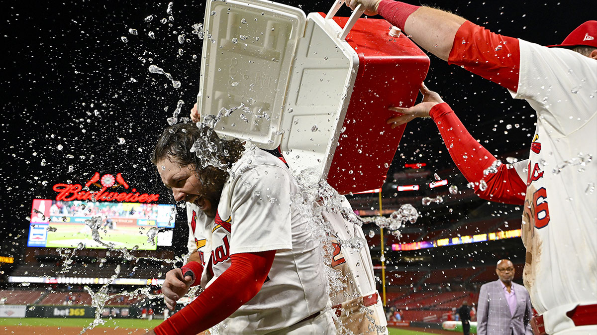 St. Louis Cardinals first baseman Alec Burleson (41) is doused with water by teammates after hitting a walk-off solo home run against the Pittsburgh Pirates during the ninth inning at Busch Stadium.