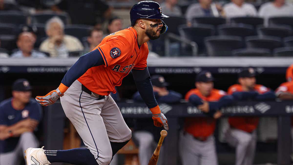 Houston Astros shortstop Carlos Correa (1) hits an RBI single during the tenth inning against the New York Yankees at Yankee Stadium.