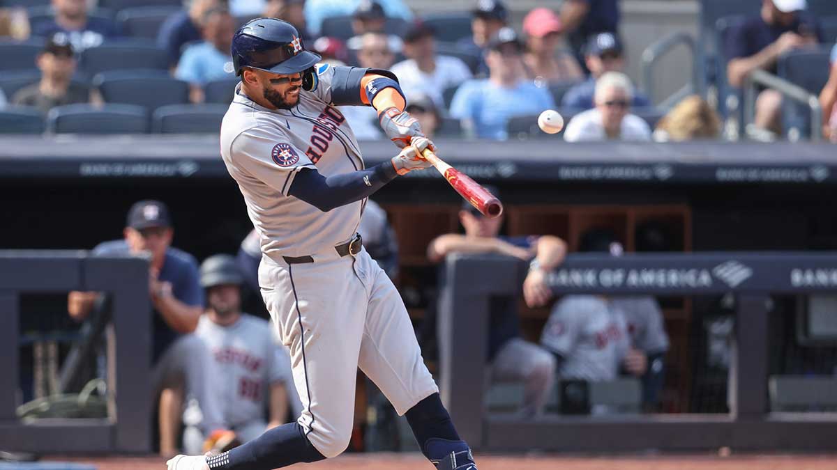 Houston Astros third baseman Carlos Correa (1) hits a solo home run in the ninth inning against the New York Yankees at Yankee Stadium.