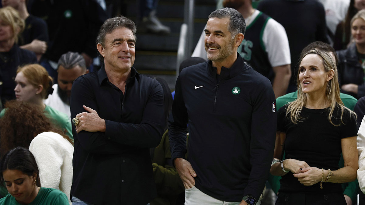 Bill Chisholm, center, who leads a group that is buying the Boston Celtics, stands with current owner Wyc Grousbeck and Chisholm’s wife, Kimberly Chisholm before the game between the Boston Celtics and the Phoenix Suns at TD Garden.