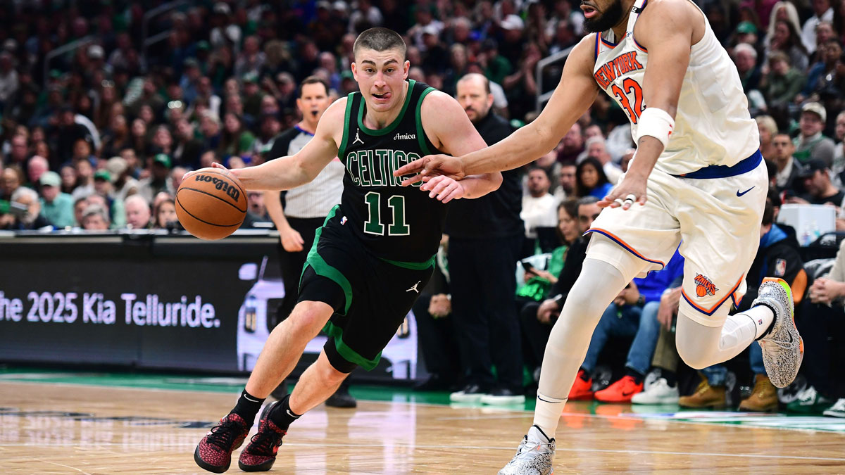 Celtics guard Payton Pritchard (11) controls the ball while New York Knicks center Karl-Anthony Towns (32) defends in the second half during game five of the second round for the 2025 NBA Playoffs at TD Garden