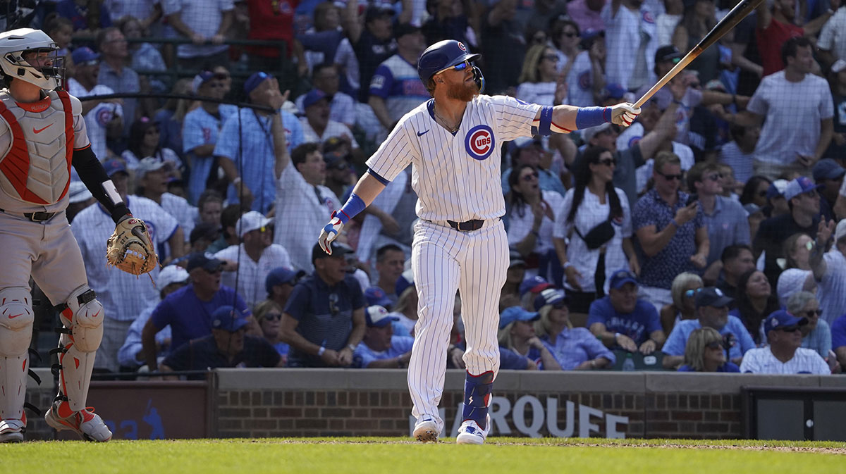 Chicago Cubs pinch hitter Justin Turner (3) hits a two-run game winning home run against the Baltimore Orioles during the ninth inning at Wrigley Field.