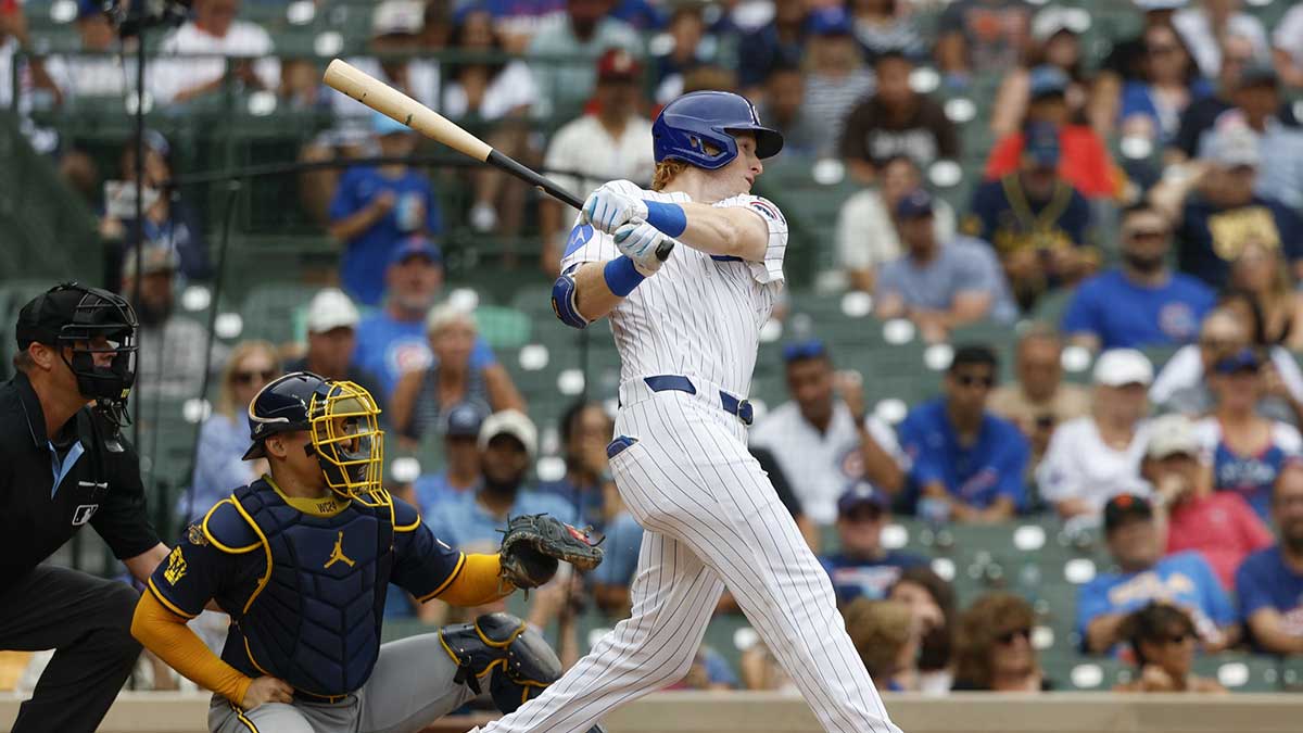 Chicago Cubs right fielder Owen Caissie (19) hits a solo home run against the Milwaukee Brewers during the sixth inning of the game one of the doubleheader at Wrigley Field.