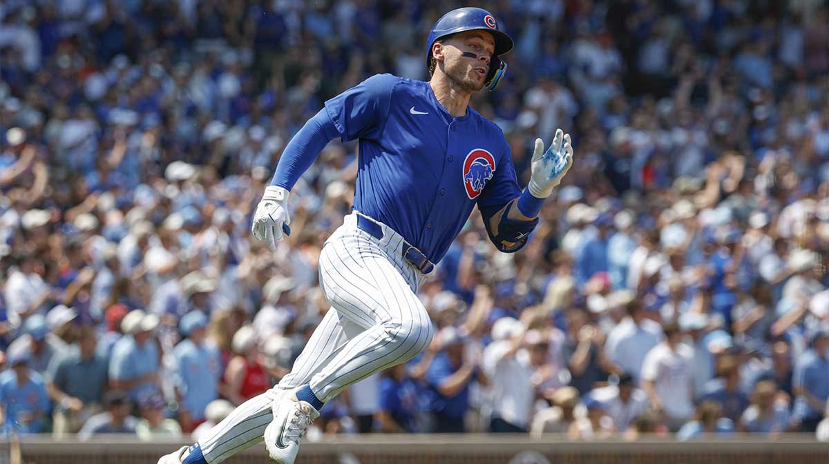 Chicago Cubs shortstop Nico Hoerner (2) wearing number 23 in honor the late Hall of Fame second baseman Ryne Sandberg runs after hitting an RBI-ground rule double against the Baltimore Orioles during the second inning at Wrigley Field.